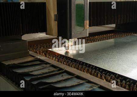 High-Precision Laser Cutting Machine Operates on Thick Sheet Metal with Exacting Efficiency and Technology Stock Photo
