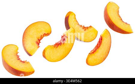 Falling peach slices isolated on white background Stock Photo