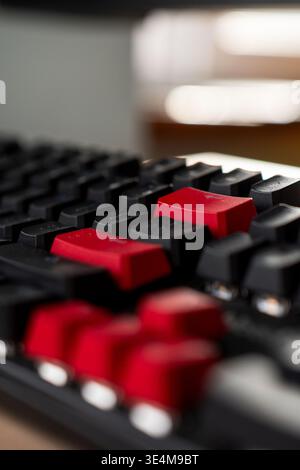 Close-up View of a Black and Red Computer Keyboard with Focus on Unique Key Design and Textured Surface Stock Photo