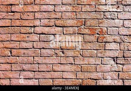 Old weathered red brick wall as creative background, close up Stock Photo