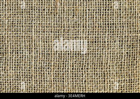 Natural sacking burlap background. Natural light brown burlap fabric texture. Sackcloth woven texture background Stock Photo