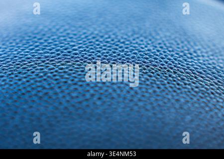 Close-Up of a Textured Blue Leather Surface Showcasing Its Unique Grain and Depth in Color and Design Stock Photo
