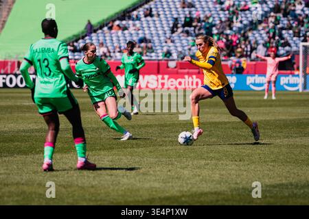 Kate Del Fava (Utah Royals FC) dribbles the ball past two Boston Legacy FC players during an NWSL match at Gillette Stadium. Stock Photo