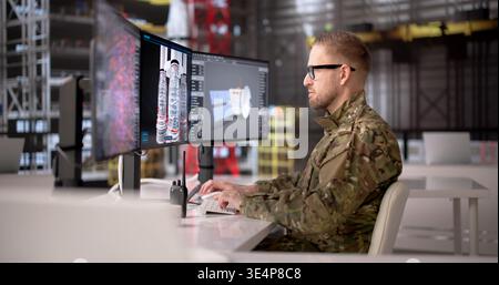Young Rocket Engineer Analyzes Industrial Computer Systems At A Modern Workstation Stock Photo