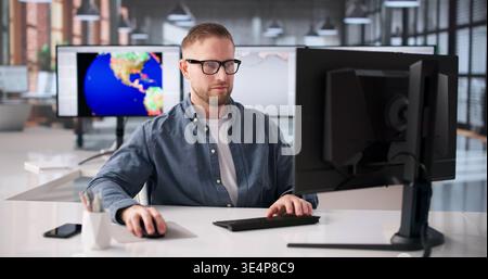 Meteorologist Analyzes Climate Data On Computer To Track Weather Changes Stock Photo