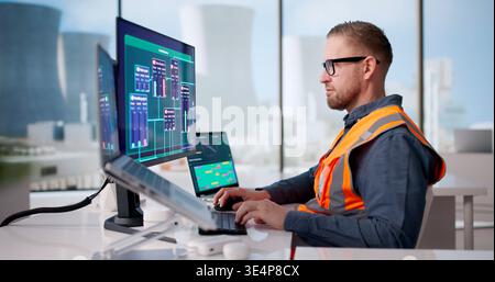 Engineer Diligently Oversees SCADA Network Managing Nuclear Power Facility Operations Stock Photo