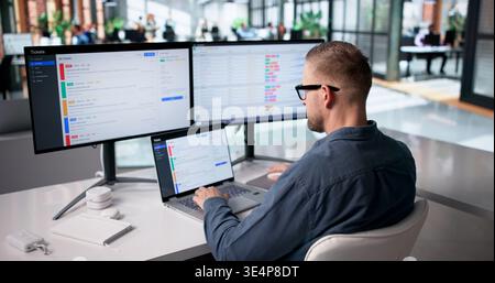 IT Specialist Diligently Oversees System Security And Support Ticket Management For Optimal Network Performance Stock Photo