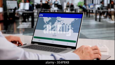 Hispanic Man Using VPN To Boost Online Privacy And Cybersecurity Protection Stock Photo