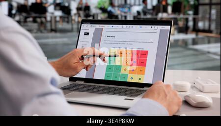 Business Risk Analyst Reviews Enterprise Data To Enhance Strategic Planning Stock Photo