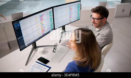 Analyzing Healthcare Information On Computers In A Training Workshop Stock Photo