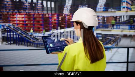Warehouse Supervisor Analyzing Inventory Metrics On Tablet For Streamlined Supply Chain Operations Stock Photo