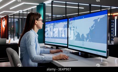 Female Cybersecurity Specialist Oversees Worldwide VPN Network For Safe Online Connectivity Stock Photo