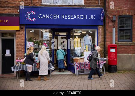 Marple village centre Cancer Research charity shop Stock Photo