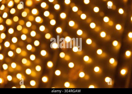 Festive Golden Light Dots Pattern for Holiday Design. Stock Photo