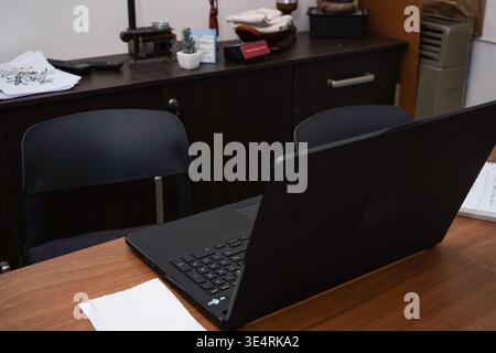 Laptop at home on a living room table ready to start working Stock Photo