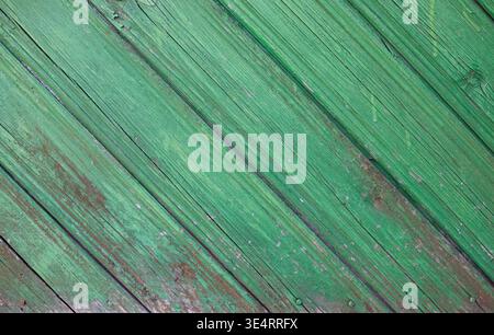 Green Wooden fence wall decoration, lining with weathered texture. Detailed background with aged timber planks with peeling paint and organic wood gra Stock Photo