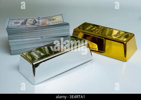Fine silver gold bar and a pile of money banknote 100 USD on a gray background Stock Photo