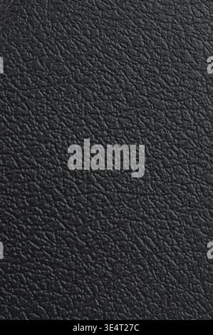 Black plastic texture with leather pattern macro close up view Stock Photo