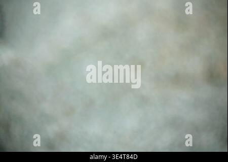 Abstract blurred background with soft grey and neutral tones, featuring a misty, out-of-focus texture perfect for minimalist design, overlays, and mod Stock Photo