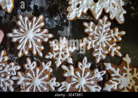 Decorated Snowflake Gingerbread Cookies on Baking Sheet Stock Photo