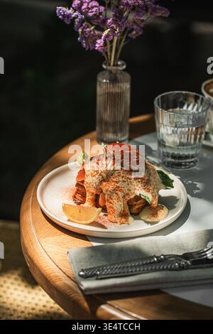 Salmon toast with poached egg and spinach Stock Photo