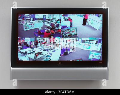 School security monitor showing the view inside classrooms in an elementary school, Pennsylvania USA Stock Photo
