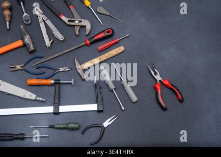Hand Tools set top view. Professional DIY different Equipment for household. Assorted work and home renovation tool flat lay. Stock Photo