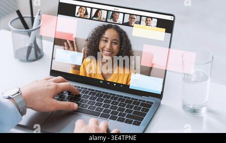 Businessman Works From Home Using Laptop During Online Meeting With Blank Screen Stock Photo