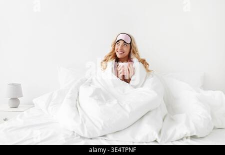 Lady enjoy good morning, weekend and vacation, delicious coffee at free time after great sleep Stock Photo