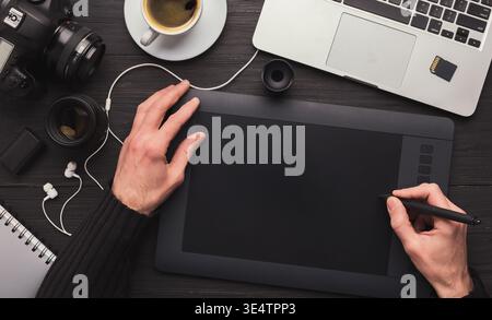 Designer hand with graphic tablet and keyboard Stock Photo