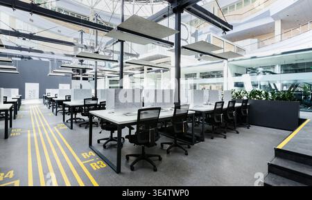 Big rental office with wrapped computers, no workers Stock Photo
