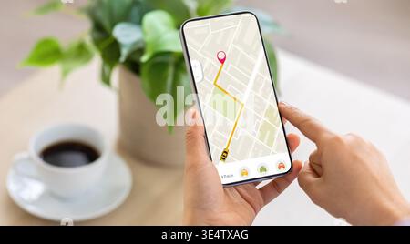 Cropped of woman using navigation mobile app on smartphone Stock Photo