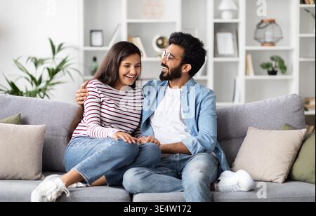 Happy young indian couple spending time together at home Stock Photo