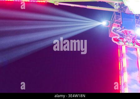Bright neon light rays cutting through haze in vibrant club atmosphere ideal for nightlife events music visuals and futuristic background designs Stock Photo
