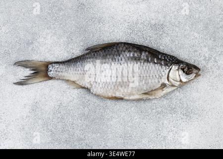 Food, Dried salted fish on grey concrete background Stock Photo