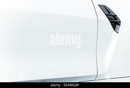 Closeup of a white car door handle isolated on white background Stock Photo