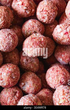 Raw frozen homemade meatballs with rice and spices, hand-formed, no packaging. Minced meat balls. Concept of meal prep, frozen food, home cooking, tra Stock Photo