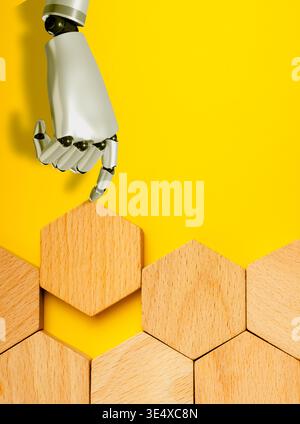 AI Robot hand placing a last wooden hexagon piece to complete on yellow background. Artificial intelligence enhancing problem solving, innovation, sma Stock Photo