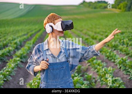 Farmer Using VR Headset in Field Stock Photo