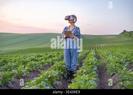 Farmer Using VR in Field Stock Photo