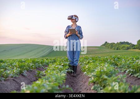 Farmer Using VR in Field Stock Photo
