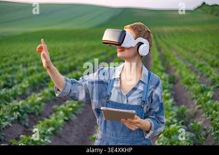 Farmer Using VR in Field Stock Photo