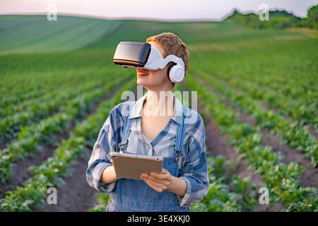 Farmer Using VR in Field Stock Photo