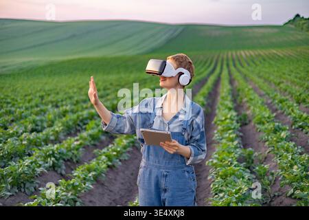Farmer Using VR in Field Stock Photo