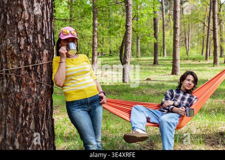 Forest picnic moment with family relaxing in spring nature Stock Photo