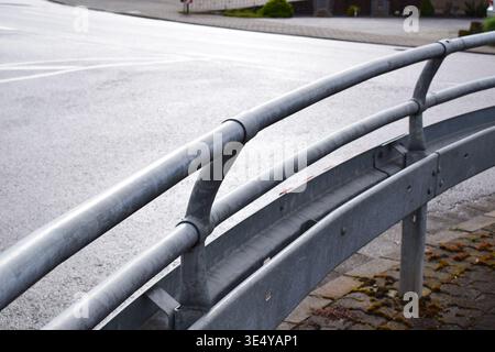 extra high guardrail to protect pedestrians ad a curve Stock Photo