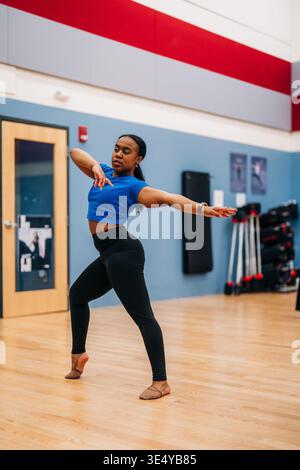 Female dancer practicing movement in studio rehearsal Stock Photo