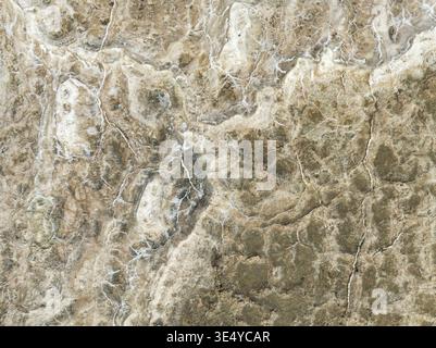 Aerial view of the textured earth unfolds in shades of beige and cream, creating an abstract landscape, Walvis Bay, Erongo Region, Namibia. Stock Photo
