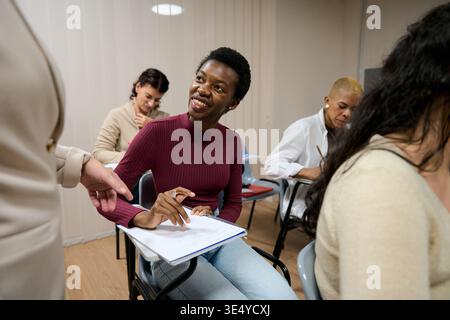 Students learning in a diverse classroom environment Stock Photo