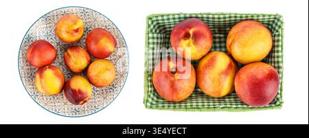 Fresh ripe nectarines arranged on decorative plate and in green basket isolated on white background. Organic summer stone fruits with red and yellow s Stock Photo